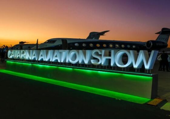 Illuminated sign for Animation Show at dusk with a colorful sky.
